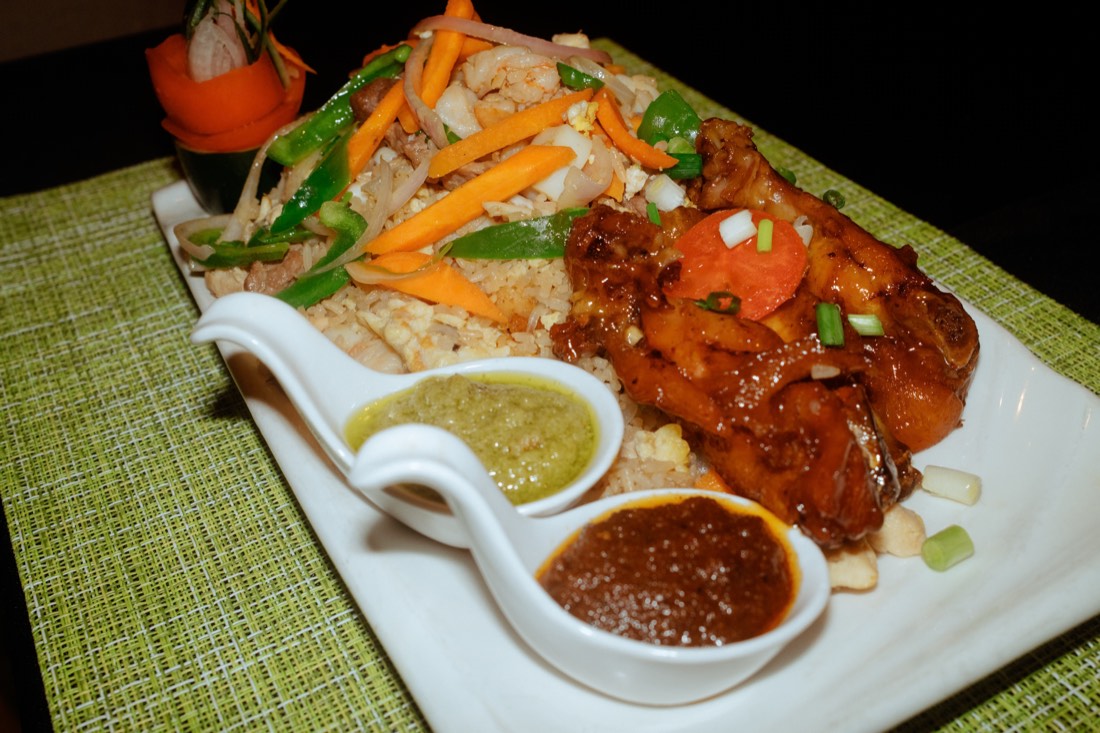 Fried rice with glazed chicken and dipping sauces
